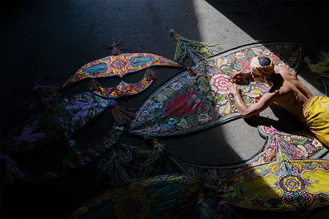 Colorful embroidered umbrellas under natural light