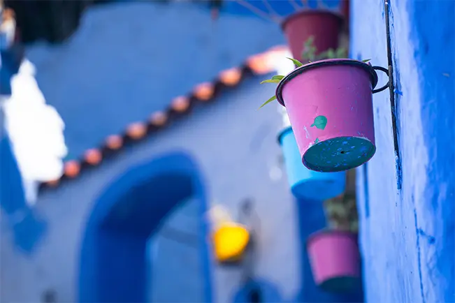 Blue building with hanging lantern and soft background bokeh
