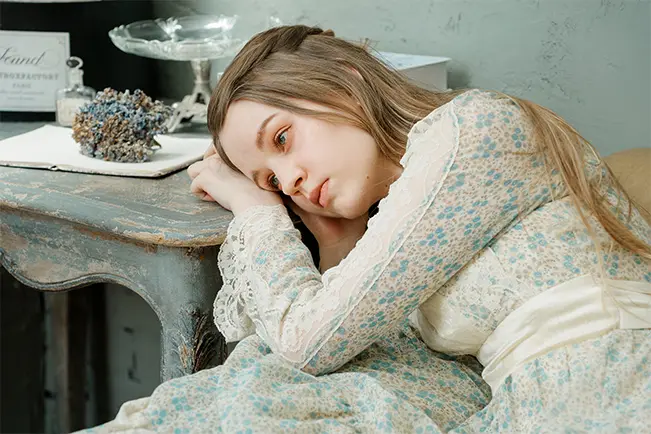 Woman resting at a table