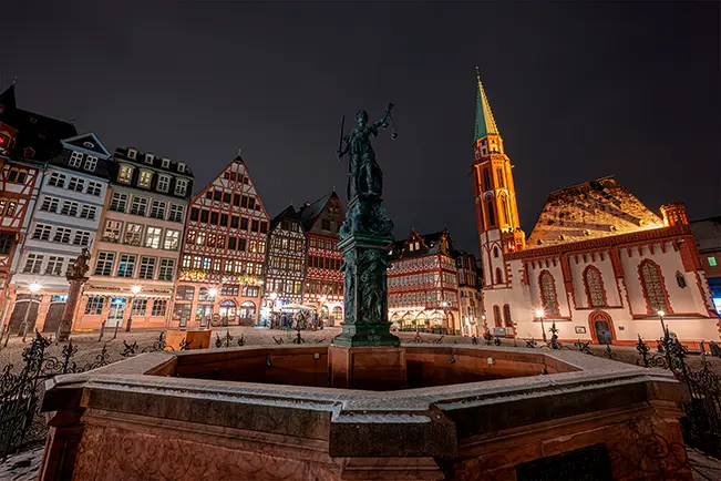 Historic city square at night