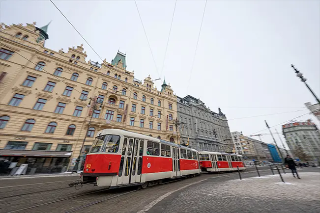 Red tram on a city street