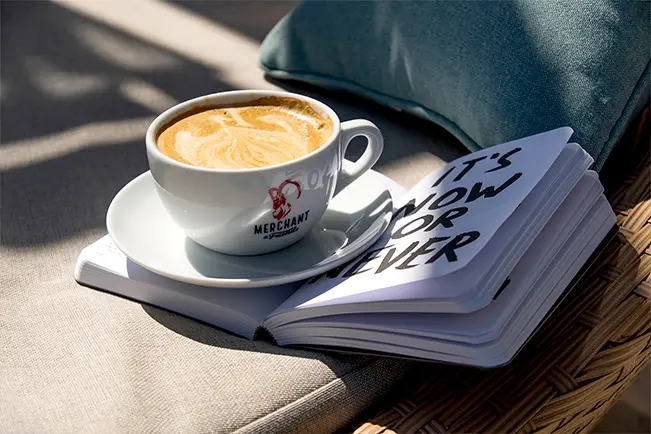 Cup of coffee with a book
