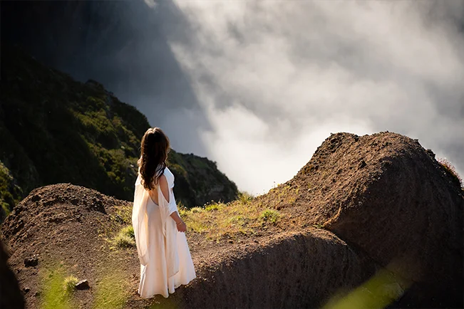 Person hiking through a mountain landscape