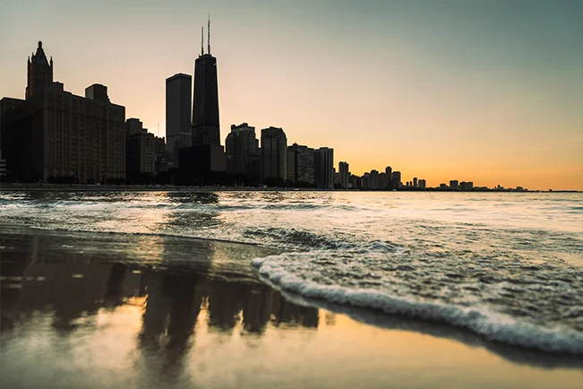 City skyline reflected in calm water